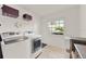 Laundry room with washer, dryer, and extra storage space at 734 Riverbend Blvd, Longwood, FL 32779