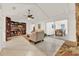 Bright living room with built-in bookcase and fireplace, offering a cozy atmosphere at 734 Riverbend Blvd, Longwood, FL 32779