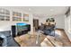 Sunlit Gathering room with tile floors, leather furniture, and a dining area at 734 Riverbend Blvd, Longwood, FL 32779
