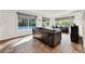 Gathering room with pool view, leather sofas, and tile floors at 734 Riverbend Blvd, Longwood, FL 32779