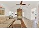Open living room with a stone fireplace and comfy seating at 734 Riverbend Blvd, Longwood, FL 32779
