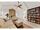 Living area with stone fireplace and built-in shelving at 734 Riverbend Blvd, Longwood, FL 32779