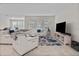 Spacious living room with comfortable seating and large TV at 1092 Downswing Pl, Davenport, FL 33896