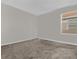 Simple bedroom with neutral walls and carpet at 1092 Downswing Pl, Davenport, FL 33896