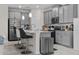 Modern kitchen with gray cabinets, quartz countertops, and island at 1092 Downswing Pl, Davenport, FL 33896