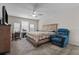 Spacious bedroom with carpeted floor, ceiling fan, and room for a workspace at 1092 Downswing Pl, Davenport, FL 33896