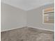 Simple bedroom with neutral walls and carpet at 1092 Downswing Pl, Davenport, FL 33896