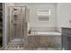 Bathroom with a shower and tub combo at 1092 Downswing Pl, Davenport, FL 33896