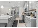 Modern kitchen with gray cabinets, quartz countertops, and island at 1092 Downswing Pl, Davenport, FL 33896