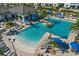 Community pool area with lounge chairs and a clubhouse at 1092 Downswing Pl, Davenport, FL 33896