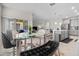 Open kitchen with island and modern gray cabinets, flows into breakfast nook at 1092 Downswing Pl, Davenport, FL 33896