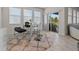 Bright breakfast nook features glass table and chairs, offering casual dining space at 1092 Downswing Pl, Davenport, FL 33896