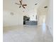 Open concept living room with views into kitchen and hallway at 3995 Scarlet Branch Rd, Orlando, FL 32824