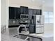 Modern kitchen with stainless steel appliances and granite countertops at 3995 Scarlet Branch Rd, Orlando, FL 32824