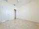Spacious bedroom featuring tile floors and a double-door closet at 3995 Scarlet Branch Rd, Orlando, FL 32824