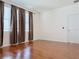 Hardwood floor bedroom with window, blinds, and curtains at 3995 Scarlet Branch Rd, Orlando, FL 32824