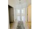 Clean and bright hallway with access to bedrooms and bathrooms at 3995 Scarlet Branch Rd, Orlando, FL 32824