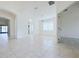 Dining room with tile floors and view into living room at 3995 Scarlet Branch Rd, Orlando, FL 32824