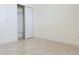Empty bedroom with closet and tile floors at 3995 Scarlet Branch Rd, Orlando, FL 32824