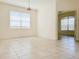 Bright living room with tile floors and views into other rooms at 3995 Scarlet Branch Rd, Orlando, FL 32824