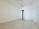 Simple bedroom with tile flooring and walk in closet at 3995 Scarlet Branch Rd, Orlando, FL 32824