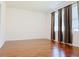 Bedroom with hardwood floors, window, and curtains at 3995 Scarlet Branch Rd, Orlando, FL 32824