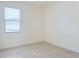 Empty bedroom with tile flooring and window with blinds at 3995 Scarlet Branch Rd, Orlando, FL 32824