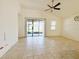 Living room with tile flooring and access to backyard at 3995 Scarlet Branch Rd, Orlando, FL 32824