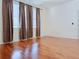 Bright bedroom with hardwood floors and curtains at 3995 Scarlet Branch Rd, Orlando, FL 32824