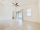 Open living room with tile floors and sliding glass doors at 3995 Scarlet Branch Rd, Orlando, FL 32824