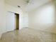 Bright bedroom with tile floors and double door closet at 3995 Scarlet Branch Rd, Orlando, FL 32824