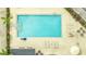 Relaxing resort-style pool with lounge chairs and umbrellas at 3000 Maingate Ln # 113, Kissimmee, FL 34747