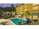Inviting hotel pool with ample lounge chairs at 3000 Maingate Ln # 113, Kissimmee, FL 34747