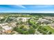 Aerial showing a hotel in a commercial and residential area at 3000 Maingate Ln # 113, Kissimmee, FL 34747