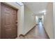 Clean and well-lit hotel corridor with tiled floors at 3000 Maingate Ln # 113, Kissimmee, FL 34747