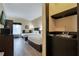 Hotel room with two beds, kitchenette and bathroom access at 3000 Maingate Ln # 113, Kissimmee, FL 34747