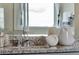 Modern bathroom boasts granite countertop and stylish fixtures at 1771 Three Bars Rd, Kissimmee, FL 34744