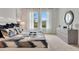 Light and airy bedroom with large windows and a dresser at 1771 Three Bars Rd, Kissimmee, FL 34744