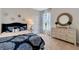 Cozy bedroom with patterned bedding and neutral decor at 1771 Three Bars Rd, Kissimmee, FL 34744