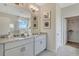 Elegant bathroom with double vanity and walk-in closet at 1771 Three Bars Rd, Kissimmee, FL 34744