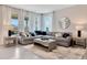 Relaxing living room featuring a sectional sofa, coffee table, and a large window with natural light at 1771 Three Bars Rd, Kissimmee, FL 34744