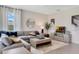 Comfortable living room with large sectional sofa, coffee table, and plenty of natural light at 1771 Three Bars Rd, Kissimmee, FL 34744