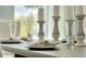 Modern dining room with place settings and candle holders at 1771 Three Bars Rd, Kissimmee, FL 34744