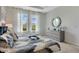 Bright bedroom with large windows and dresser at 1771 Three Bars Rd, Kissimmee, FL 34744