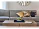Elegant living room featuring a gray sofa and stylish coffee table at 1771 Three Bars Rd, Kissimmee, FL 34744