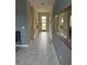Elegant entryway with tiled floor and modern console table at 2813 Bookmark Dr, Kissimmee, FL 34746