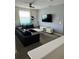 Comfortable living room featuring a sectional sofa and large TV at 2813 Bookmark Dr, Kissimmee, FL 34746