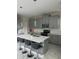 Modern kitchen with gray cabinets, white countertops, and an island at 2813 Bookmark Dr, Kissimmee, FL 34746