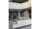 Open concept living room with white sectional sofa at 2813 Bookmark Dr, Kissimmee, FL 34746