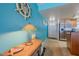 Bright entryway with unique lamp and coastal decor at 5501 S Atlantic Ave # 307, New Smyrna Beach, FL 32169